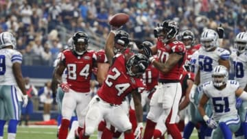 Sep 27, 2015; Arlington, TX, USA; Atlanta Falcons running back Devonta Freeman (24) spikes the ball after scoring a touchdown in the second quarter against the Dallas Cowboys at AT&T Stadium. Mandatory Credit: Matthew Emmons-USA TODAY Sports