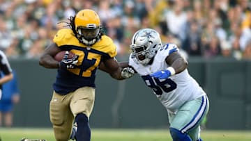 GREEN BAY, WI - OCTOBER 16: Eddie Lacy #27 of the Green Bay Packers looks to avoid the tackle attempt from Maliek Collins #96 of the Dallas Cowboys during the second quarter at Lambeau Field on October 16, 2016 in Green Bay, Wisconsin. (Photo by Hannah Foslien/Getty Images)