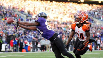 Nov 10, 2013; Baltimore, MD, USA; Baltimore Ravens wide receiver Torrey Smith (82) dives but cannot make the catch over Cincinnati Bengals cornerback Adam Jones (24) at M&T Bank Stadium. Mandatory Credit: Evan Habeeb-USA TODAY Sports