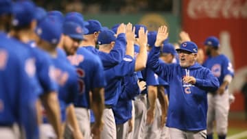Oct 7, 2015; Pittsburgh, PA, USA; Chicago Cubs manager Joe Maddon (70) high fives his team during introductions prior to the National League Wild Card playoff baseball game against the Pittsburgh Pirates at PNC Park. Mandatory Credit: Charles LeClaire-USA TODAY Sports