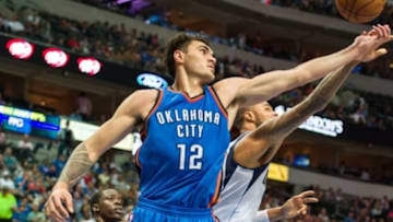 Oct 10, 2014; Dallas, TX, USA; Oklahoma City Thunder center Steven Adams (12) and Dallas Mavericks center Tyson Chandler (6) fight for the ball during the first half at the American Airlines Center. Mandatory Credit: Jerome Miron-USA TODAY Sports