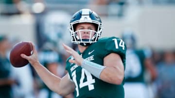 EAST LANSING, MI - AUGUST 30: Brian Lewerke #14 of the Michigan State Spartans warms up prior to a game against the Tulsa Golden Hurricane at Spartan Stadium on August 30, 2019 in East Lansing, Michigan. (Photo by Joe Robbins/Getty Images)
