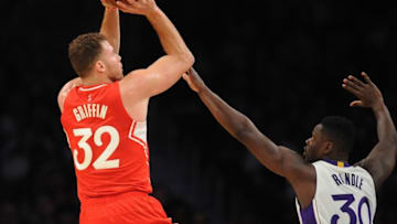December 25, 2015; Los Angeles, CA, USA; Los Angeles Clippers forward Blake Griffin (32) shoots against Los Angeles Lakers forward Julius Randle (30) during the second half of an NBA basketball game on Christmas at Staples Center. Mandatory Credit: Gary A. Vasquez-USA TODAY Sports