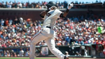 Jul 30, 2016; San Francisco, CA, USA; San Francisco Giants shortstop Eduardo Nunez (10) hits an rbi double during the fourth inning of the game against the Washington Nationals at AT&T Park. Mandatory Credit: Ed Szczepanski-USA TODAY Sports