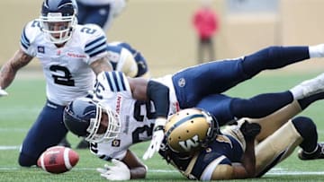 The Toronto Argonauts lose the ball against the Winnipeg Blue Bombers. (Photo by Marianne Helm/Getty Images)