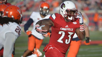 Nov 14, 2015; Louisville, KY, USA; Louisville Cardinals running back Brandon Radcliff (23) runs the ball against the Virginia Cavaliers during the second half at Papa John