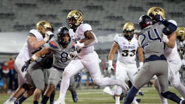 Dec 5, 2020; Tucson, Arizona, USA; Colorado Buffaloes running back Ashaad Clayton (0) runs for runs for a touchdown against the Arizona Wildcats during the first half at Arizona Stadium. Mandatory Credit: Joe Camporeale-USA TODAY Sports