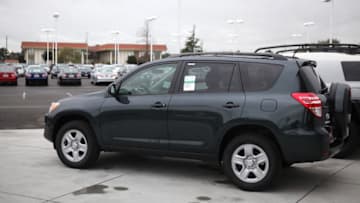 OAKLAND, CA - FEBRUARY 24: A Toyota RAV4 sits on the sales lot at a Toyota dealership on February 24, 2011 in Oakland, California. Toyota announced today that it will recall nearly 2.2 million vehicles that have floor mats that could interfere with their gas pedals. The list of cars to be recalled includes 761,000 2006-10 RAV4, 603,000 2003-09 4Runner models and 17,000 2008-11 Lexus LX 570 models. (Photo by Justin Sullivan/Getty Images)