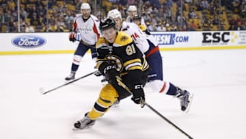 Sep 22, 2015; Boston, MA, USA; Boston Bruins left wing Anton Blidh (81) keeps the puck away from Washington Capitals defenseman John Carlson (74) during the first period at TD Garden. Mandatory Credit: Greg M. Cooper-USA TODAY Sports