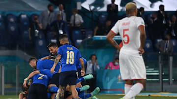 Italy's players celebrate their second goal against Switzerland (Photo by ANDREAS SOLARO/POOL/AFP via Getty Images)