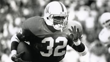 Nebraska football running back Ken Clark (32) runs with the ball Oklahoma State Cowboys. Ken Clark ranks fifth on Nebraska's all-time rushing list with 3,037 yards. (Malcolm Emmons-USA TODAY Sports)