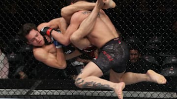 SANTIAGO, CHILE - MAY 19: (R-L) Gabriel Benitez of Mexico slams Humberto Bandenay of Peru to the mat in their featherweight bout during the UFC Fight Night event at Movistar Arena on May 19, 2018 in Santiago, Chile. (Photo by Buda Mendes/Zuffa LLC/Zuffa LLC via Getty Images)