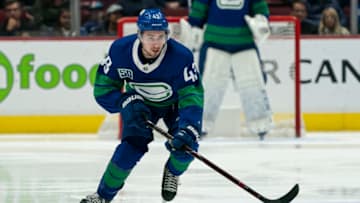 VANCOUVER, BC - NOVEMBER 05: Quinn Hughes #43 of the Vancouver Canucks skates with the puck during NHL action against the St. Louis Blues at Rogers Arena on November 5, 2019 in Vancouver, Canada. (Photo by Rich Lam/Getty Images)