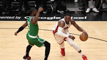 Bam Adebayo #13 of the Miami Heat dribbles against Jaylen Brown #7 of the Boston Celtics(Photo by Eric Espada/Getty Images)