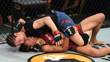 SAINT PETERSBURG, RUSSIA - APRIL 20: Roxanne Modafferi (top) controls the body of Antonina Shevchenko of Kyrgyzstan in their women's flyweight bout during the UFC Fight Night event at Yubileyny Sports Palace on April 20, 2019 in Saint Petersburg, Russia. (Photo by Jeff Bottari/Zuffa LLC/Zuffa LLC via Getty Images)