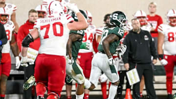 Michigan State's Chester Kimbrough, right, returns an interception against Nebraska during overtime on Saturday, Sept. 25, 2021, at Spartan Stadium in East Lansing.210925 Msu Nebraska 250a