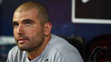 ATLANTA, GEORGIA - AUGUST 03: Joey Votto #9 of the Cincinnati Reds sits in the dugout during the 5th inning against the Atlanta Braves at SunTrust Park on August 03, 2019 in Atlanta, Georgia. (Photo by Logan Riely/Getty Images)