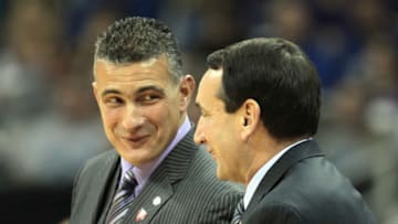 KANSAS CITY, MO - NOVEMBER 23: Head coach Frank Martin of the Kansas State Wildcats talks with head coach Mike Krzyzewski of the Duke Blue Devils during the CBE Classic championship game on November 23, 2010 at the Sprint Center in Kansas City, Missouri. (Photo by Jamie Squire/Getty Images)