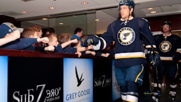 ST. LOUIS, MO - APRIL 05: Jaden Schwartz #9 of the St. Louis Blues is greeted by young fans in the Sub Zero lounge outside the Blues locker room before an NHL game against the Colorado Avalanche on April 5, 2014 at Scottrade Center in St. Louis, Missouri. (Photo by Mark Buckner/NHLI via Getty Images)