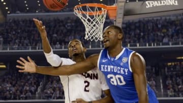 Apr 7, 2014; Arlington, TX, USA; Kentucky Wildcats forward Julius Randle (30) battles for a loose ball with Connecticut Huskies forward DeAndre Daniels (2) in the second half during the championship game of the Final Four in the 2014 NCAA Mens Division I Championship tournament at AT&T Stadium. Mandatory Credit: Robert Deutsch-USA TODAY Sports
