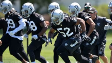 Jun 15, 2016; Alameda, CA, USA; Oakland Raiders defensive end Khalil Mack (52), cornerback T.J. Carrie (38) and cornerback David Amerson (29) at minicamp at the Raiders practice facility. Mandatory Credit: Kirby Lee-USA TODAY Sports