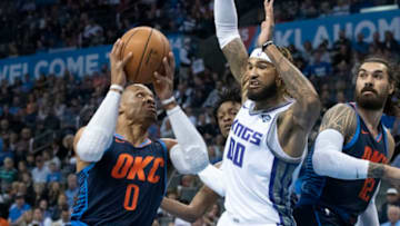 OKLAHOMA CITY, OK - OCTOBER 21: Russell Westbrook #0 of the Oklahoma City Thunder shoots as Willie Cauley-Stein #00 of the Sacramento Kings applies pressure during the first half of a NBA game at the Chesapeake Energy Arena on October 21, 2018 in Oklahoma City, Oklahoma. NOTE TO USER: User expressly acknowledges and agrees that, by downloading and or using this photograph, User is consenting to the terms and conditions of the Getty Images License Agreement. (Photo by J Pat Carter/Getty Images)