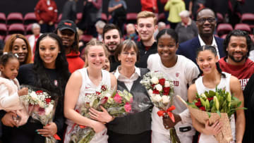 PALO ALTO, CA - FEBRUARY 9: Head coach Tara VanDerveer of the Stanford Cardinal (center) poses for a picture with her seniors including, from left, DiJonai Carrington, Mikaela Brewer, Nadia Fingall and Anna Wilson, alongside her older brother Seattle Seahawks quarterback Russell Wilson, far right, after the NCAA women's basketball game at Maples Pavilion on February 9, 2020 in Palo Alto, California. (Photo by Cody Glenn/Getty Images)