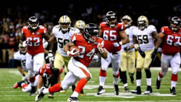 Oct 15, 2015; New Orleans, LA, USA; Atlanta Falcons running back Devonta Freeman (24) runs for a touchdown against the New Orleans Saints during the fourth quarter of a game at the Mercedes-Benz Superdome. The Saints defeated the Falcons 31-21. Mandatory Credit: Derick E. Hingle-USA TODAY Sports