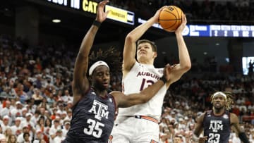 Auburn basketballFeb 12, 2022; Auburn, Alabama, USA; Auburn Tigers forward Walker Kessler (13) goes for a shot against Texas A&M Aggies guard Manny Obaseki (35) during the second half at Auburn Arena. Kessler had his second triple double of the season. Mandatory Credit: John Reed-USA TODAY Sports
