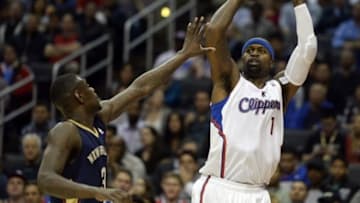 Dec 18, 2013; Los Angeles, CA, USA; Los Angeles Clippers small forward Stephen Jackson (1) looks to pass against New Orleans Pelicans shooting guard Anthony Morrow (3) during the second quarter at Staples Center. Mandatory Credit: Richard Mackson-USA TODAY Sports