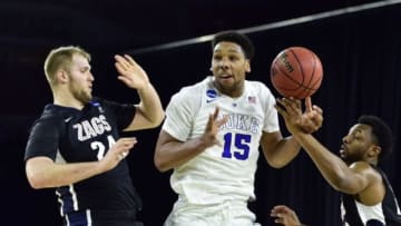 Mar 29, 2015; Houston, TX, USA; Duke Blue Devils center Jahlil Okafor (15) loses the ball between Gonzaga Bulldogs center Przemek Karnowski (24) and guard Byron Wesley (22) during the first half in the finals of the south regional of the 2015 NCAA Tournament at Reliant Stadium. Mandatory Credit: Bob Donnan-USA TODAY Sports