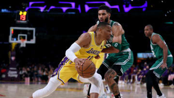 LOS ANGELES, CALIFORNIA - DECEMBER 07: Russell Westbrook #0 of the Los Angeles Lakers drives to the basket on Jayson Tatum #0 of the Boston Celtics during the first half at Staples Center on December 07, 2021 in Los Angeles, California. NOTE TO USER: User expressly acknowledges and agrees that, by downloading and/or using this Photograph, user is consenting to the terms and conditions of the Getty Images License Agreement. Mandatory Copyright Notice: Copyright 2021 NBAE (Photo by Harry How/Getty Images)