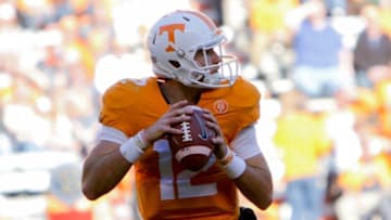 Nov 14, 2015; Knoxville, TN, USA; Tennessee Volunteers quarterback Quinten Dormady (12) drops back to pass against the North Texas Mean Green during the second half at Neyland Stadium. Tennessee won 24 to 0. Mandatory Credit: Randy Sartin-USA TODAY Sports