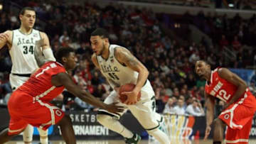 Mar 13, 2015; Chicago, IL, USA; Michigan State Spartans guard Denzel Valentine (45) drives to the basket between Ohio State Buckeyes forward Jae'Sean Tate (1) and forward Sam Thompson (12) during the second half in the quarterfinals of the Big Ten Tournament at United Center. Mandatory Credit: Caylor Arnold-USA TODAY Sports