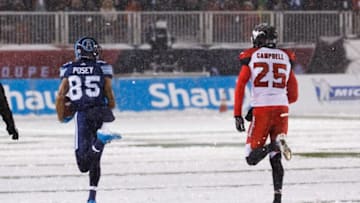 DeVier Posey #85 of the Toronto Argonauts outruns Tommie Campbell #25 of the Calgary Stampeders, scoring a touchdown after his catch during the first half of the 105th Grey Cup Championship Game at TD Place Stadium. (Photo by Andre Ringuette/Getty Images)