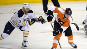 Apr 6, 2014; Philadelphia, PA, USA; Buffalo Sabres left wing Ville Leino (23) hooks Philadelphia Flyers center Brayden Schenn (10) during the third period at Wells Fargo Center. The Flyers defeated the Sabres, 5-2. Mandatory Credit: Eric Hartline-USA TODAY Sports