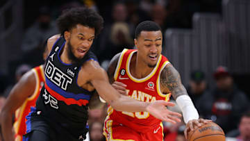 John Collins #20 of the Atlanta Hawks battles for a loose ball against Marvin Bagley III #35 of the Detroit Pistons (Photo by Kevin C. Cox/Getty Images)
