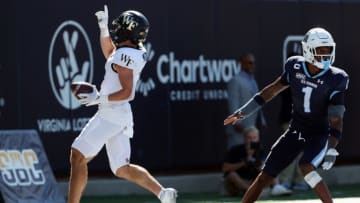 Sep 16, 2023; Norfolk, Virginia, USA; Wake Forest Demon Deacons wide receiver Taylor Morin (2) catches a touchdown pass against Old Dominion Monarchs safety Terry Jones (1) during the fourth quarter at Kornblau Field at S.B. Ballard Stadium. Mandatory Credit: Peter Casey-USA TODAY Sports