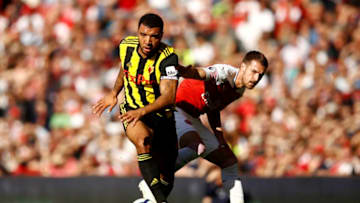 LONDON, ENGLAND - SEPTEMBER 29: Troy Deeney of Watford takes the ball away from Aaron Ramsey (R) of Arsenal during the Premier League match between Arsenal FC and Watford FC at Emirates Stadium on September 29, 2018 in London, United Kingdom. (Photo by Julian Finney/Getty Images)