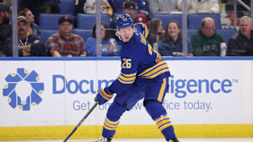 Feb 10, 2022; Buffalo, New York, USA; Buffalo Sabres defenseman Rasmus Dahlin (26) looks to make a pass during the first period against the Columbus Blue Jackets at KeyBank Center. Mandatory Credit: Timothy T. Ludwig-USA TODAY Sports