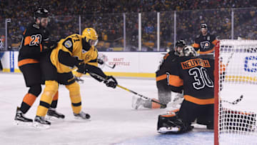 PITTSBURGH, PA - FEBRUARY 25: Pittsburgh Penguins Center Evgeni Malkin (71) puts a shot on Philadelphia Flyers Goalie Michal Neuvirth (30) the first period in the 2017 Coors Light NHL Stadium Series game between the Pittsburgh Penguins and the Philadelphia Flyers on February 25, 2017, at Heinz Field in Pittsburgh, PA. (Photo by Jeanine Leech/Icon Sportswire via Getty Images)