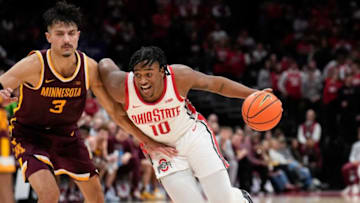 Jan 12, 2023; Columbus, Ohio, USA; Ohio State Buckeyes forward Brice Sensabaugh (10) charges past Minnesota Golden Gophers forward Dawson Garcia (3) during the second half of the men’s NCAA division I basketball game between the Ohio State Buckeyes and the Minnesota Golden Gophers at Value City Arena. Mandatory Credit: Joseph Scheller-The Columbus DispatchBasketball Ceb Mbk Minnesota Minnesota At Ohio State
