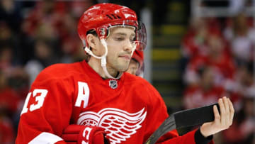 Apr 1, 2016; Detroit, MI, USA; Detroit Red Wings center Pavel Datsyuk (13) adjusts his stick during the second period against the Minnesota Wild at Joe Louis Arena. Red Wings win 3-2. Mandatory Credit: Raj Mehta-USA TODAY Sports