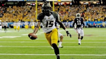 Dec 7, 2013; Atlanta, GA, USA; Missouri Tigers wide receiver Dorial Green-Beckham (15) runs a touchdown past Auburn Tigers cornerback Chris Davis (11) during the second quarter of the 2013 SEC Championship game at Georgia Dome. Mandatory Credit: Kevin Liles-USA TODAY Sports