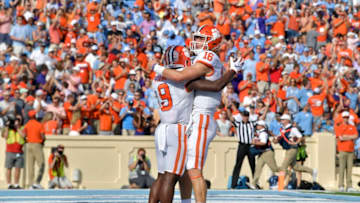 CHAPEL HILL, NORTH CAROLINA - SEPTEMBER 28: Travis Etienne #9 and Trevor Lawrence #16 of the Clemson Tigers celebrate after a touchdown during the second quarter of their game against the North Carolina Tar Heels at Kenan Stadium on September 28, 2019 in Chapel Hill, North Carolina. (Photo by Grant Halverson/Getty Images)