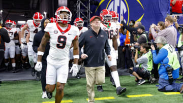 ATLANTA, GEORGIA - DECEMBER 2: Head coach Kirby Smart of the Georgia Bulldogs brings his team onto the field to warm up prior to the SEC Championship against the Alabama Crimson Tide at Mercedes-Benz Stadium on December 2, 2023 in Atlanta, Georgia. (Photo by Todd Kirkland/Getty Images)