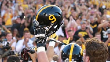 Sep 12, 2015; Ames, IA, USA; The Iowa Hawkeyes wore helmets with #9 on them to honor the late Tyler Sash who died early this week. Sash played safety for the Hawkeyes and won a Superbowl with the New York Giants. Iowa beat the Iowa State Cyclones 31-17 at Jack Trice Stadium. Mandatory Credit: Reese Strickland-USA TODAY Sports
