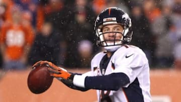 Dec 22, 2014; Cincinnati, OH, USA; Denver Broncos quarterback Peyton Manning (18) looks to pass in the second half against the Cincinnati Bengals at Paul Brown Stadium. The Bengals won 37-28. Mandatory Credit: Aaron Doster-USA TODAY Sports