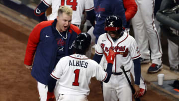 ATLANTA, GEORGIA - OCTOBER 31: Ozzie Albies #1 of the Atlanta Braves is congratulated by Joc Pederson #22 after scoring a run on a grand slam home run by Adam Duvall #14 against the Houston Astros during the first inning in Game Five of the World Series at Truist Park on October 31, 2021 in Atlanta, Georgia. (Photo by Michael Zarrilli/Getty Images)