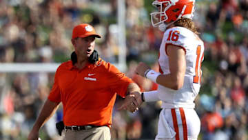 WINSTON SALEM, NC - OCTOBER 06: Head coach Dabo Swinney of the Clemson Tigers celebrates a touchdown with Trevor Lawrence #16 of the Clemson Tigers during their game at BB&T Field on October 6, 2018 in Winston Salem, North Carolina. (Photo by Streeter Lecka/Getty Images)